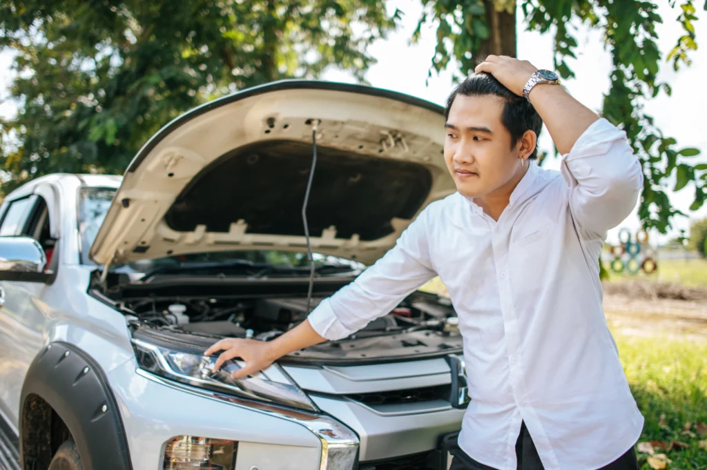 man opens hood car repair car due breakdown